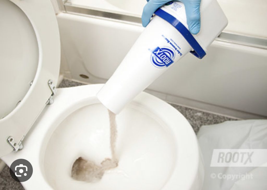 A person is using an industrial toilet cleaner.